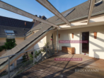 Blick von der Terrasse - Lichtdurchflutete Maisonette-Wohnung mit Sonnenterrasse & viel Platz für Ihre Familie!